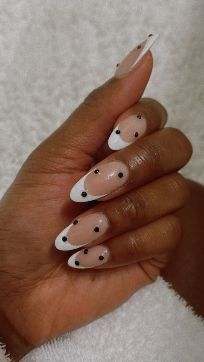 Elegant Almond-Shaped Nail Design: Nude and White with Bold Black Dots