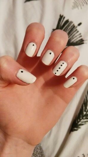 Elegant Minimalist Nail Design with Playful Black Dot Accents