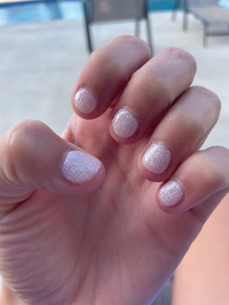 Delicate Frosted Pink Nail Design: Elegant Summer Sparkle and Texture.