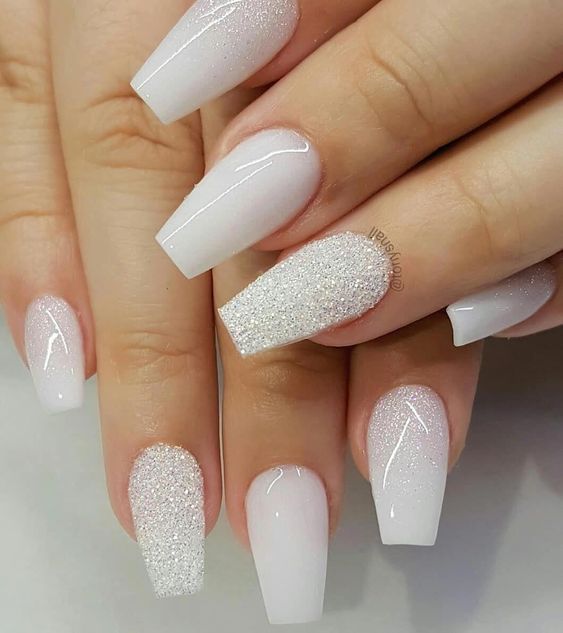 Chic White Ombre Nail Design with Glitter Accents and Square Tips.