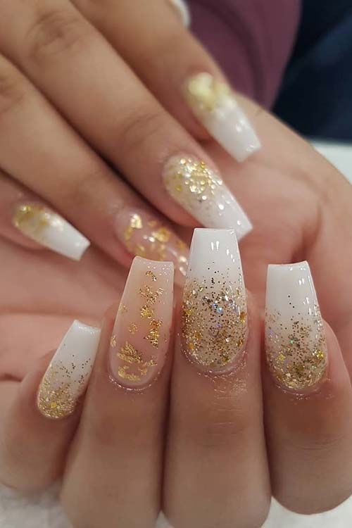 Elegant Ombre Nail Design with Sparkling Gold Accents for Glamorous Occasions.