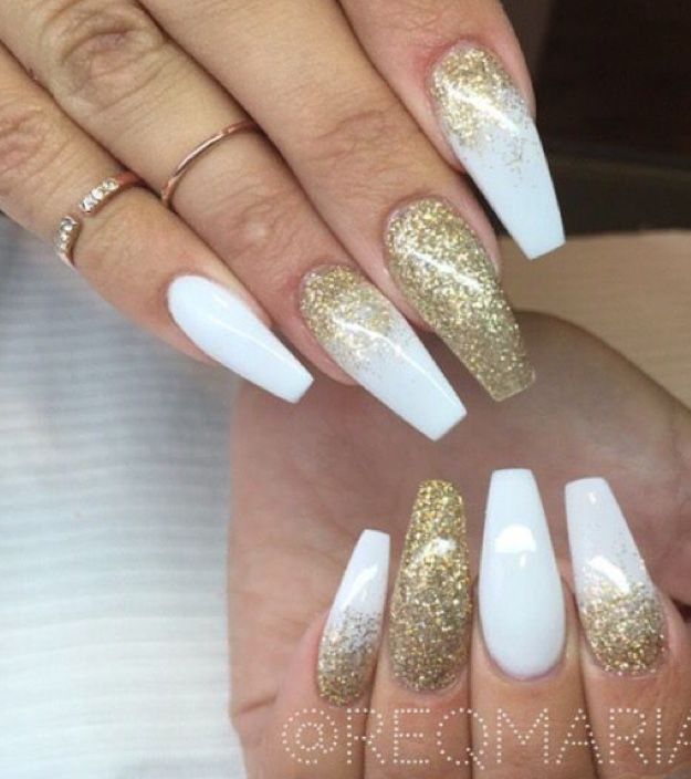 Sophisticated Nail Design: Classic White with Dazzling Gold Accents and Gradient Effects