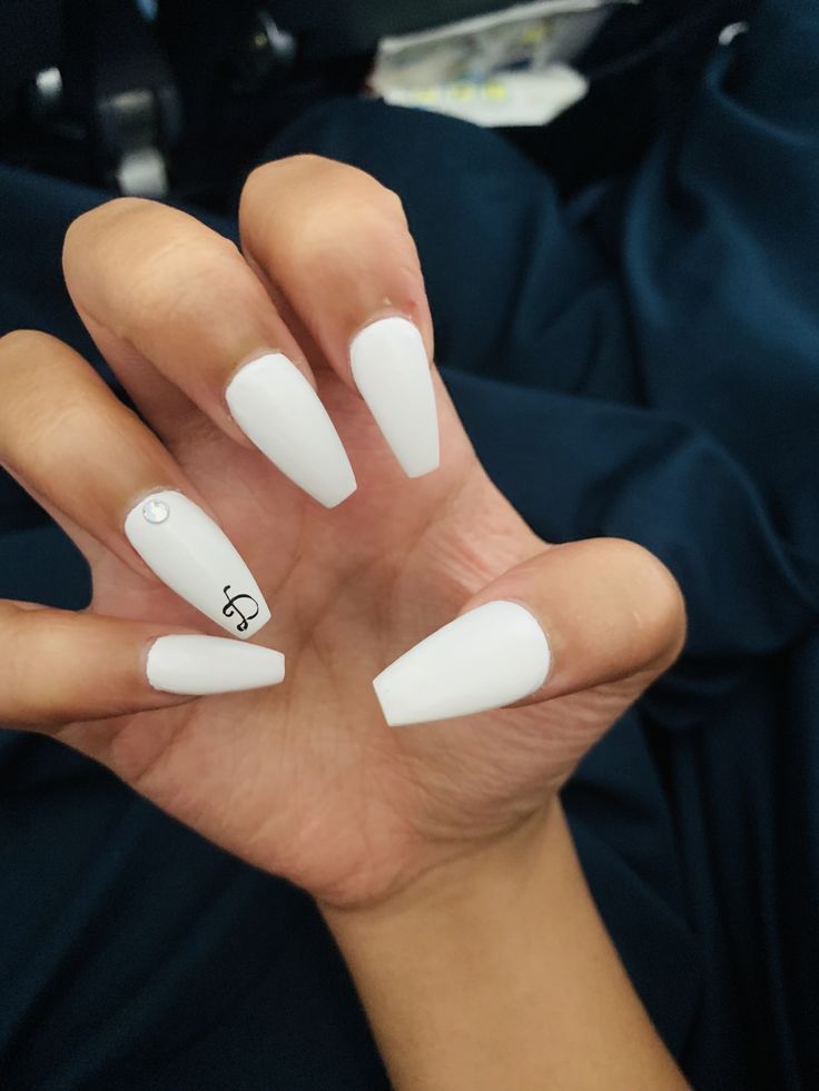 Elegant Minimalist Stiletto White Nails with Musical Note and Gem Accents