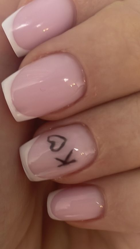 Chic Soft Pink and Classic White Nail Design with Playful Accent.