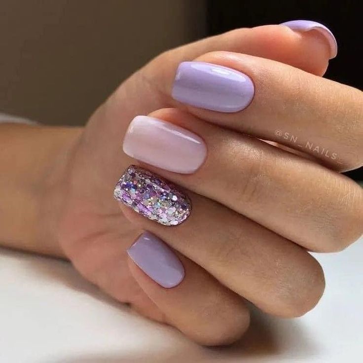 Elegant Gradient Lavender Nails with Playful Glitter Accent and Textured Finishes.