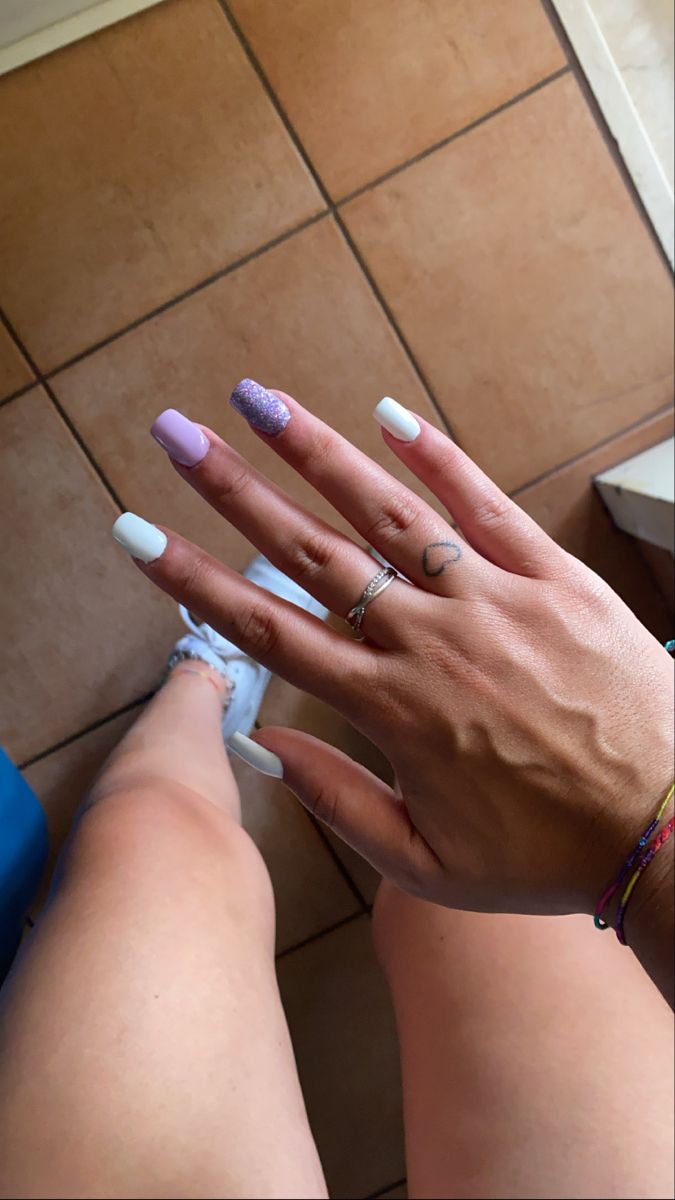 Trendy Vibrant Nail Design with Glossy White and Glittering Lavender Accents