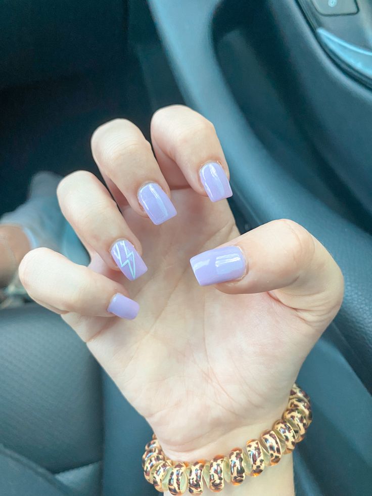 Elegant Chic Lavender Manicure with Bold Lightning Bolt Design