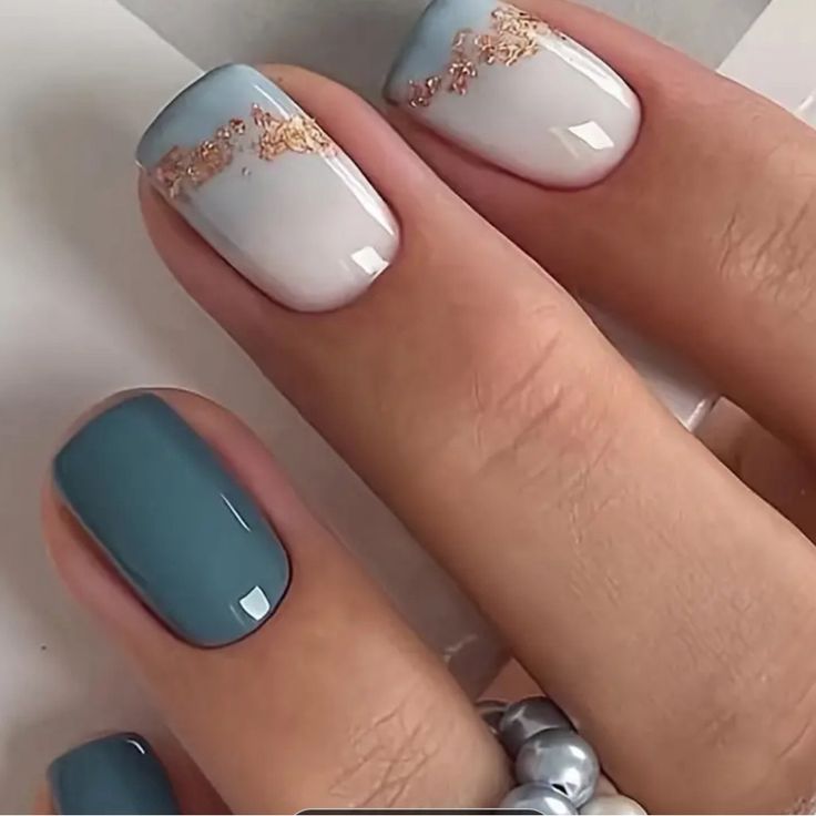 Chic Gradient Nail Design with Gold Accents and Bold Teal Contrast.