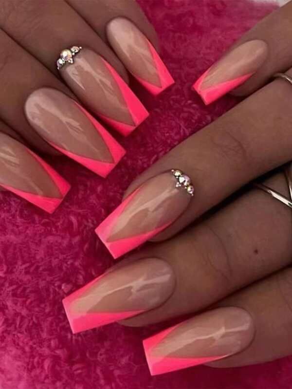 Striking Nude and Neon Pink Geometric Nail Design with Glamorous Embellishments.