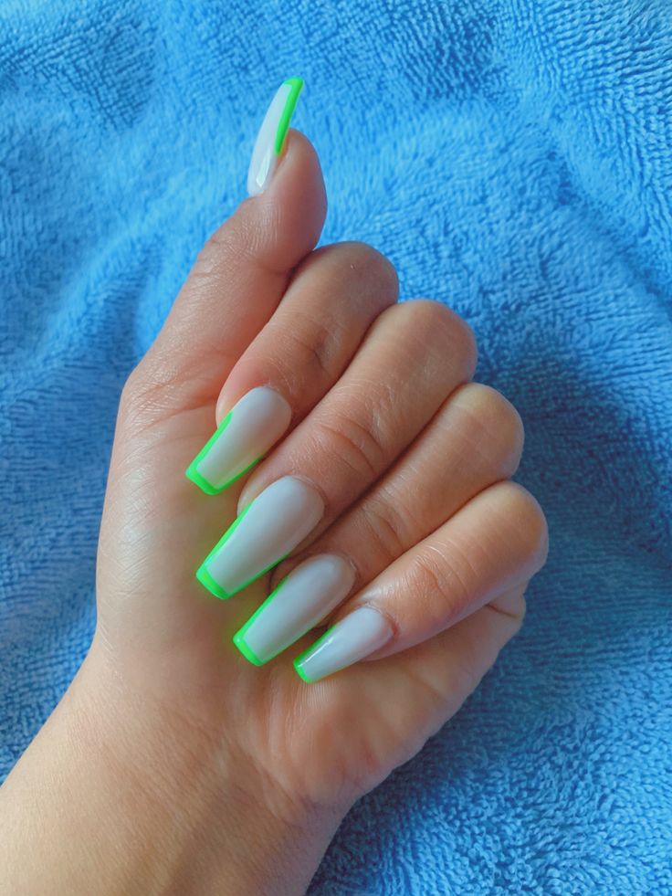 Bold Neon Green Tips on Elegant Elongated Nails: A Modern and Creative Statement Design.