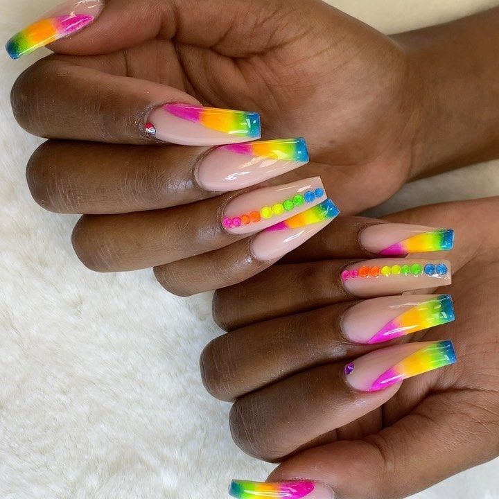 Vibrant Ombre Nail Design with Neon Colors and Playful Rhinestone Accents.