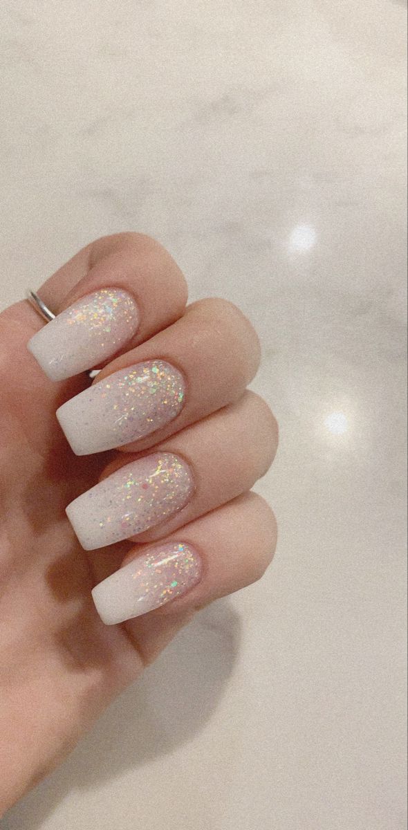 Elegant Gradient Nail Design with Soft White and Delicate Glitter