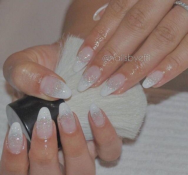 Sophisticated Ombre French Tip Nails with Glitter Accent.