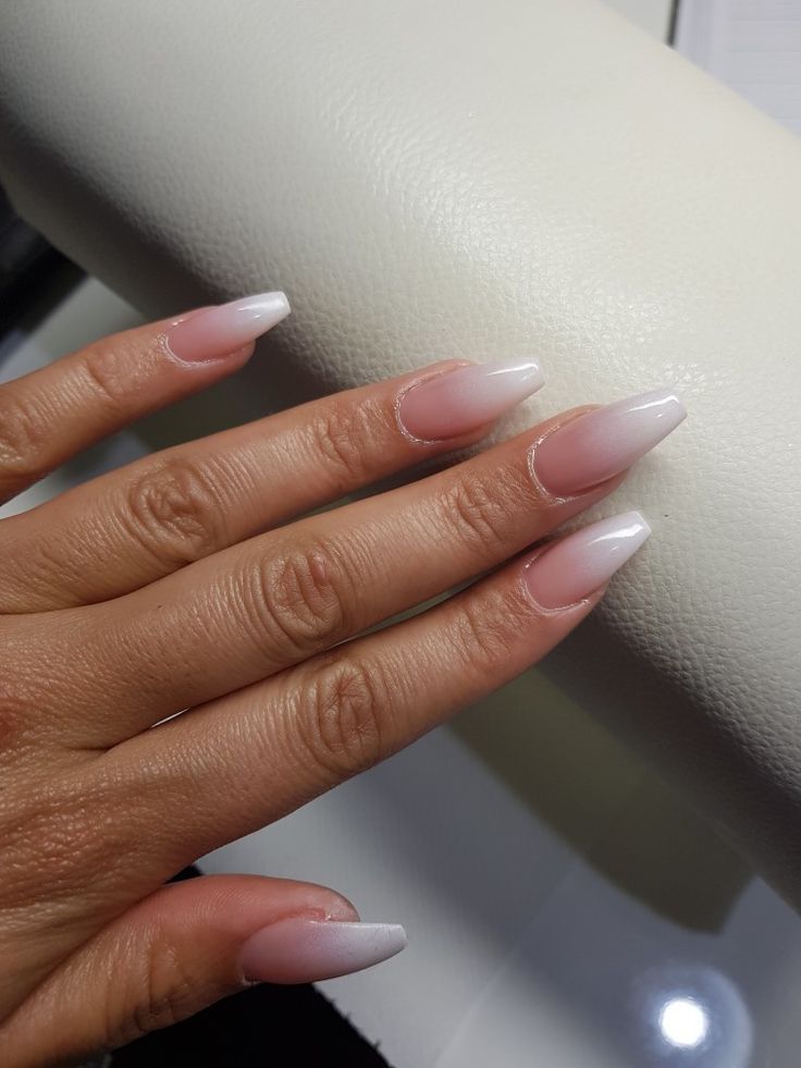 Elegant Pink and White Ombre Nails: A Sophisticated Blend for Any Occasion.