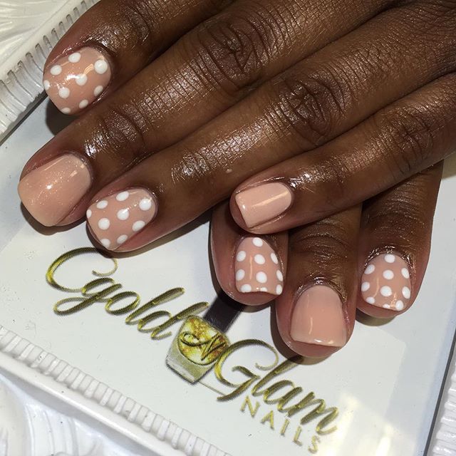 Elegant Whimsical Nail Design: Nude and Soft Pink Polka Dots