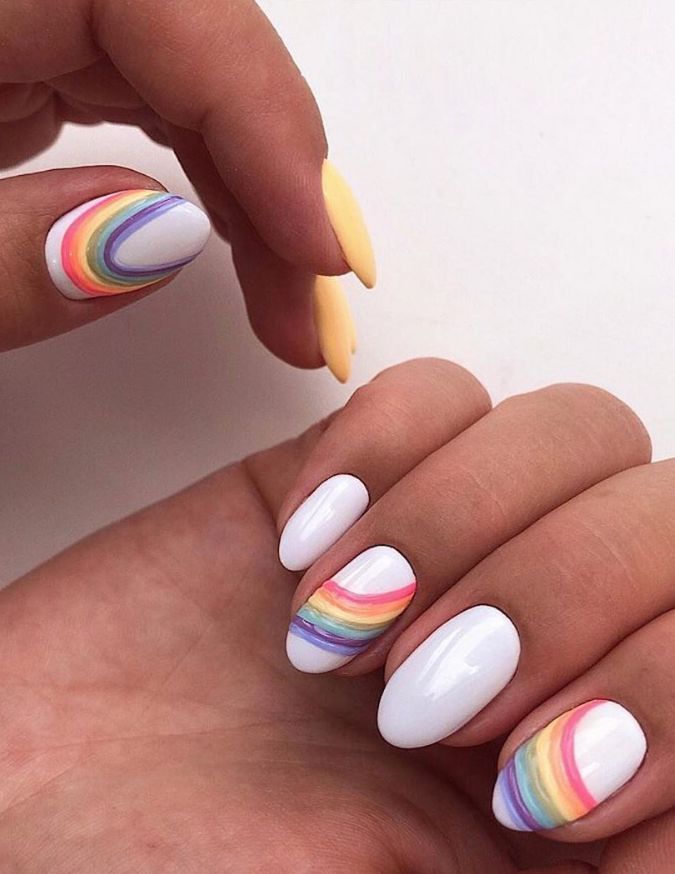 Cheerful Rainbow Nail Art on a White Base for Spring/Summer Vibes.