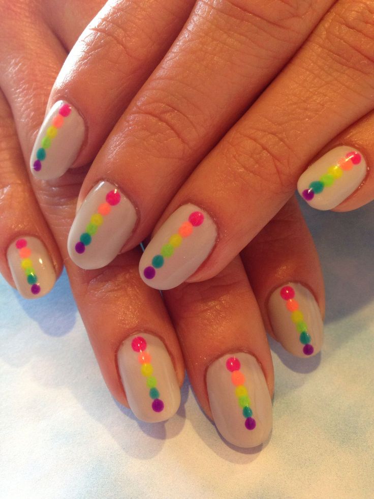 Playful Colorful Dot Nail Art on Neutral Background