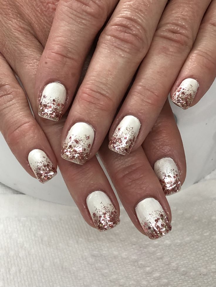 Elegant White Base Nail Design with Glitter Gradient for Glamorous Occasions.