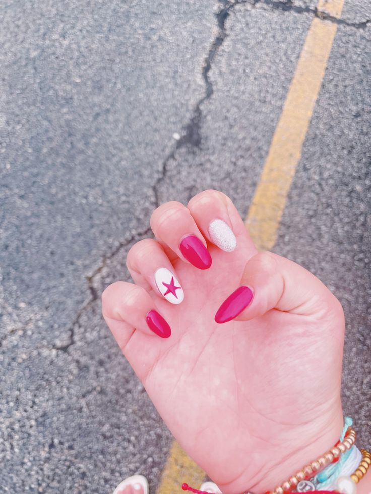 Playful Summer Manicure: Bold Pink Nails with White Accents and Star Motif