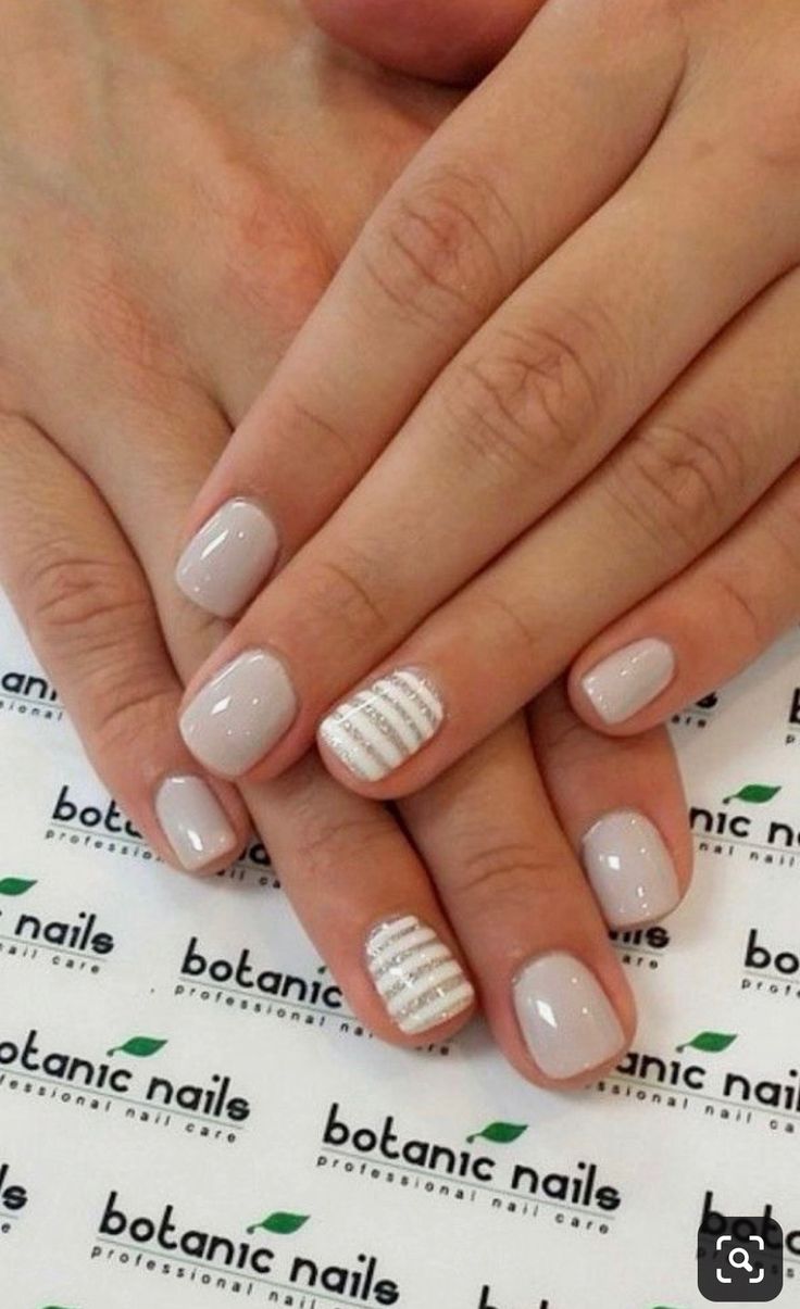 Sophisticated Elegant Nail Design with Neutral Base and Silver Accent Stripes