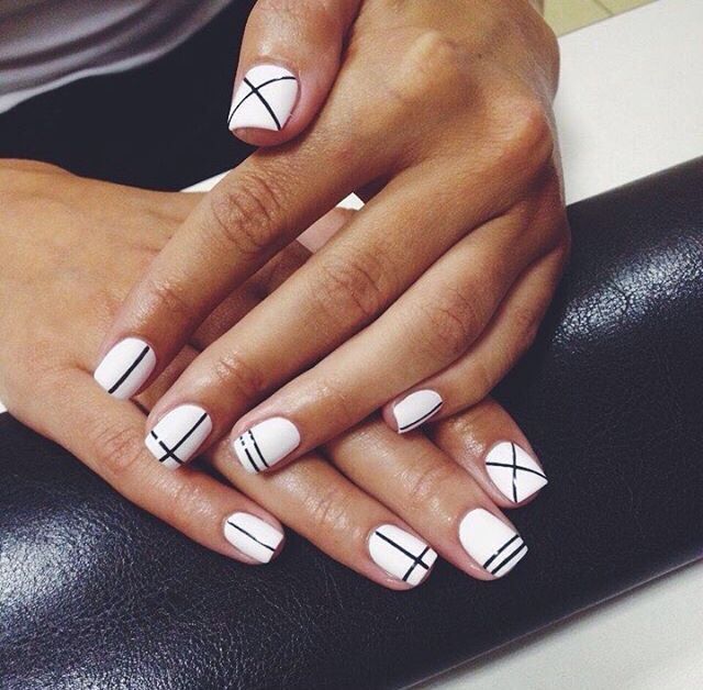 Chic Geometric Nail Design: Pristine White Base with Elegant Black Accents