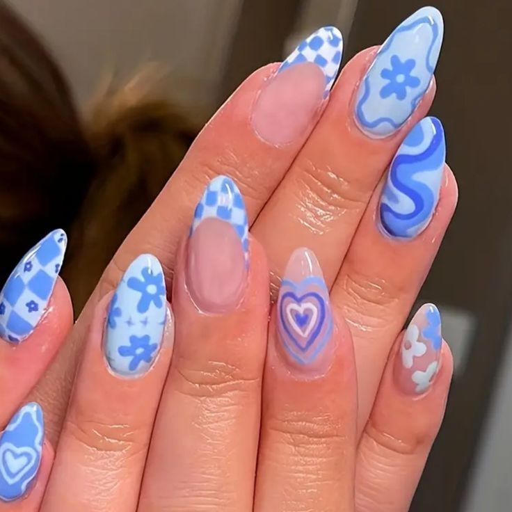 Trendy Colorful Blue Nail Design with Playful Patterns and Elongated Shape.