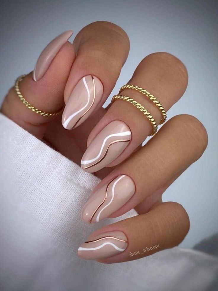 Chic Elegant Nude Nails with Wavy White Lines and Gold Accents.