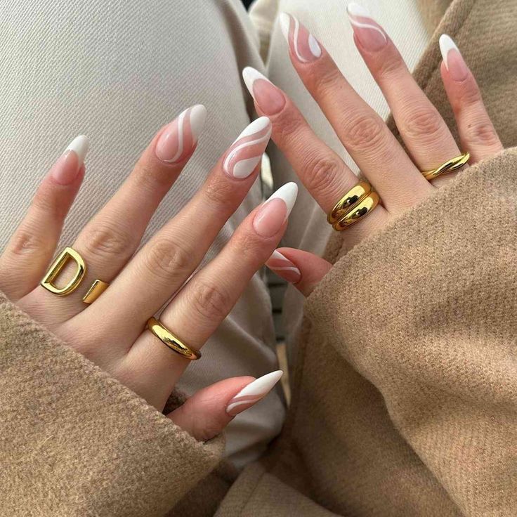 Chic Long Nails: Soft Pink and White with Elegant Swirls and Sophisticated Gold Accents.