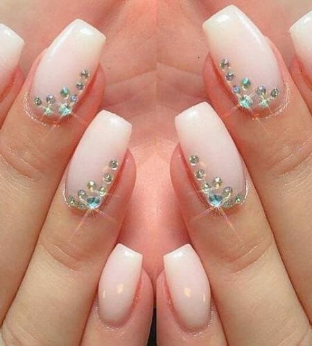 Sophisticated Ombre Nail Design with Sparkling Gemstone Accents