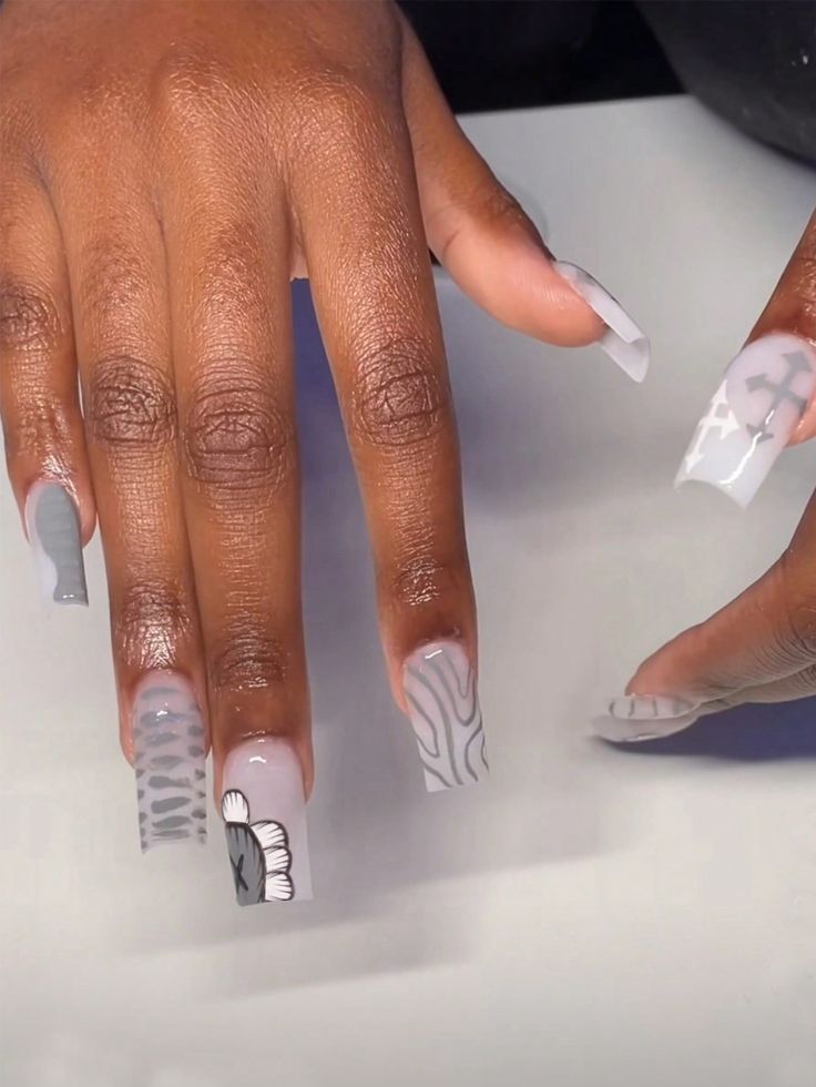 Contemporary Gray Nail Design: Intricate Patterns and Textures for a Stylish Statement.