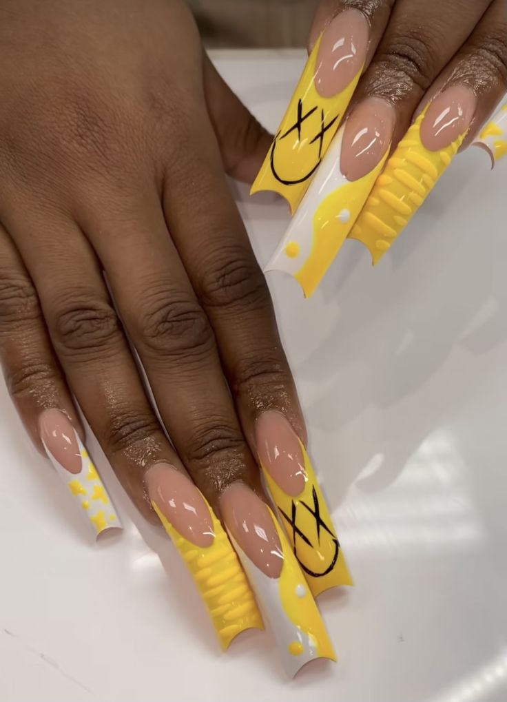 Playful Yellow Acrylic Nail Design with Abstract Patterns and Textures