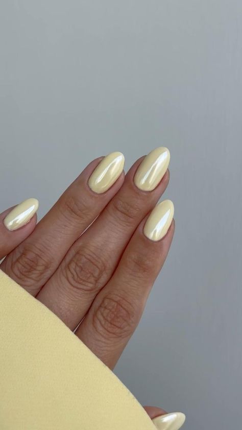 Vibrant Glossy Yellow Nail Design: A Playful Yet Sophisticated Look for Any Occasion