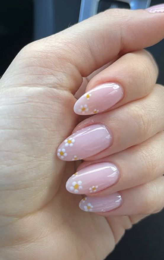 Spring-Inspired Delicate Nail Design with Soft Pink Base and Floral Accents.