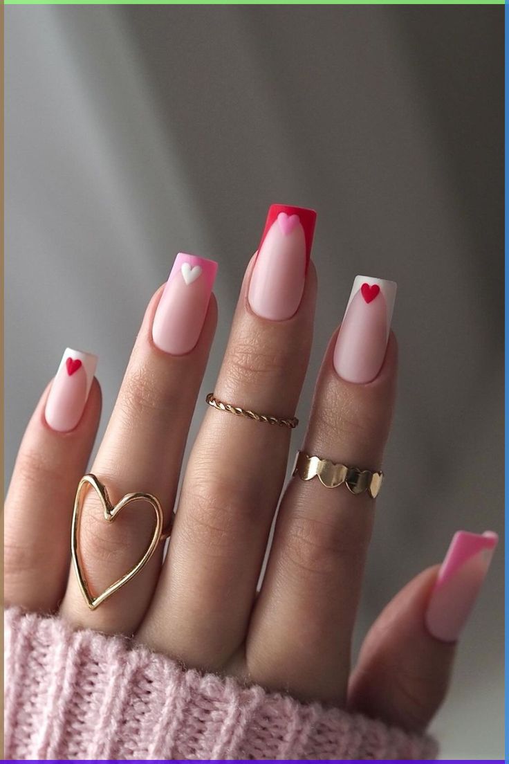 Charming Heart-Themed Nail Design with Romantic Pink, Red Tips, and Playful White Accents.