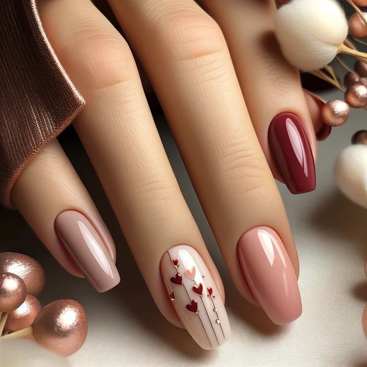 Chic Elegant Nail Design with Soft Pink and Burgundy Hues and Heart Motifs.