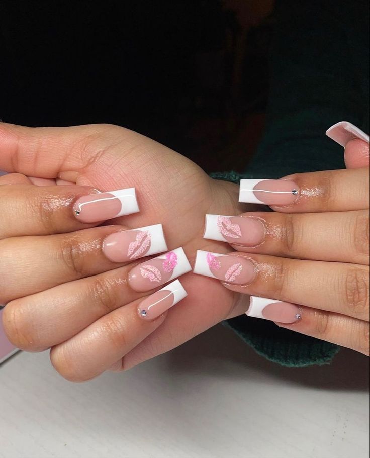 Sophisticated Nail Art: Classic French Tips with Modern Pink Leaf Patterns and Gem Accents.