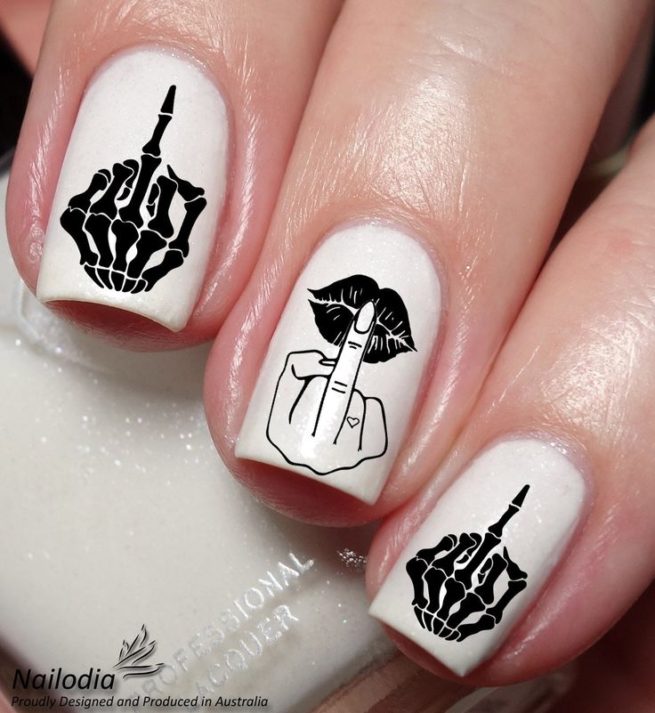 Bold Skeleton-Themed Graphic Nail Art on Clean White Background.