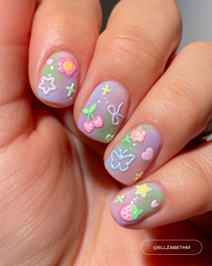 Vibrant Pastel Nail Art with Whimsical Motifs for Youthful Spring/Summer Styles.