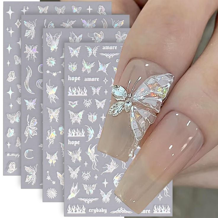 Elegant Butterfly Nail Design with Nude Base and Sparkling Gems, Enhanced by Whimsical Art Patterns.