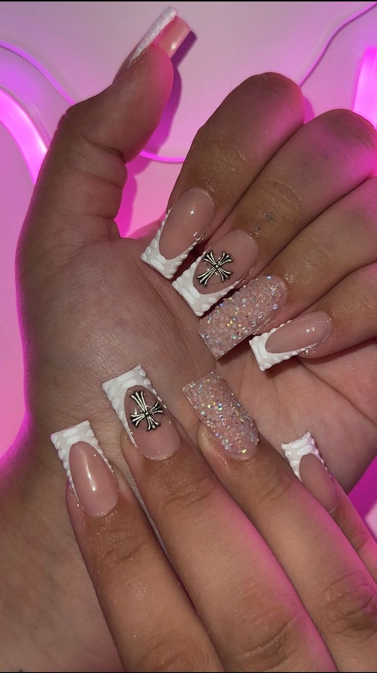 Chic Pink and White Nail Design with Sparkly Elements and Creative Textures.