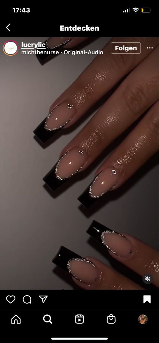 Elegant Modern French Tip Nails with Black Edges and Silver Rhinestones.