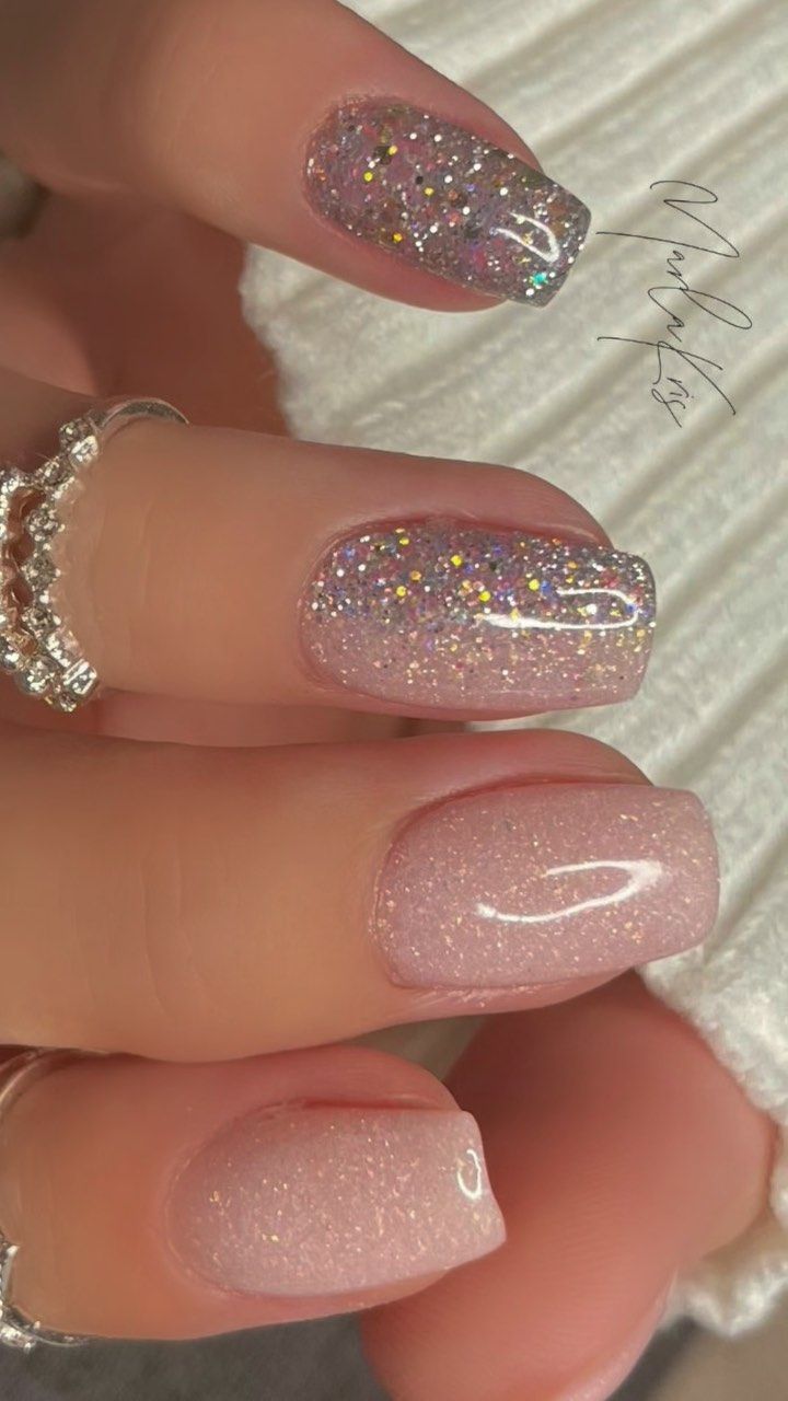 Elegant Glittering Nail Design in Soft Pink Tones with Holographic Accents.