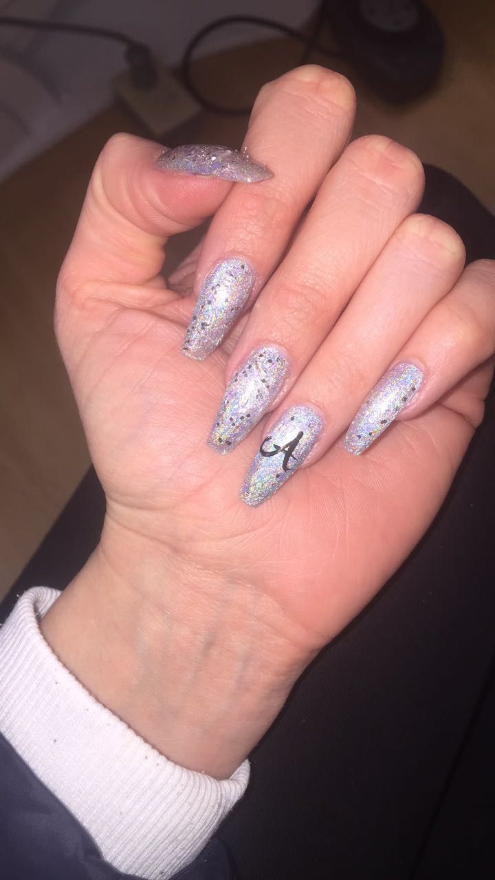 Striking Glistening Holographic Nails with Artistic Silver Glitter Detail.