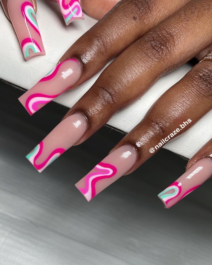 Bold Swirling Pink, White, and Mint Green Nail Design with Long Square Tips