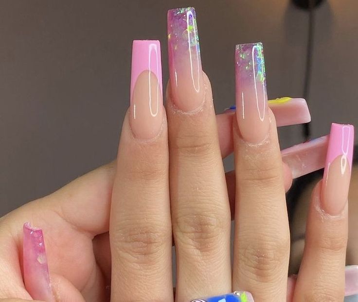 Elegant Gradient Long Nails with Iridescent Glitter and Creative Designs.