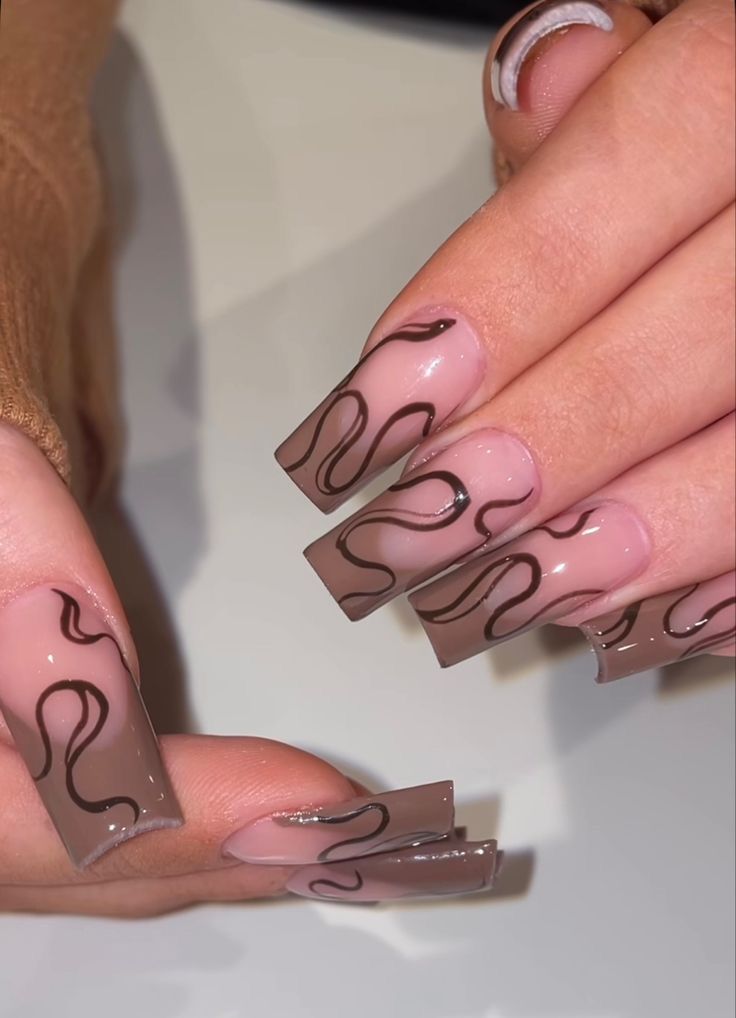 Elegant Nail Design: Soft Pink and Rich Brown with Fluid Lines for a Modern Twist.