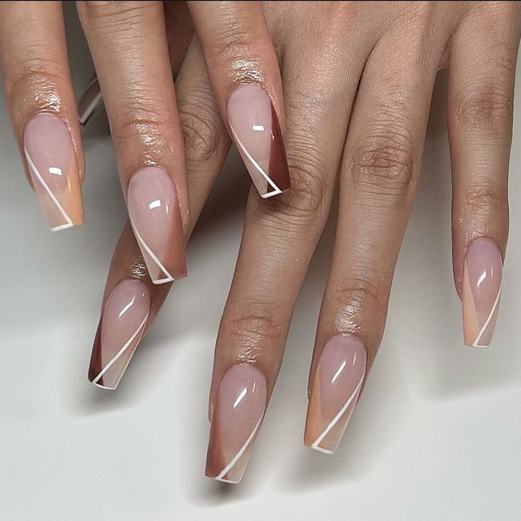 Chic Nude and Soft Pink Triangular Accent Nail Design with White Outline.