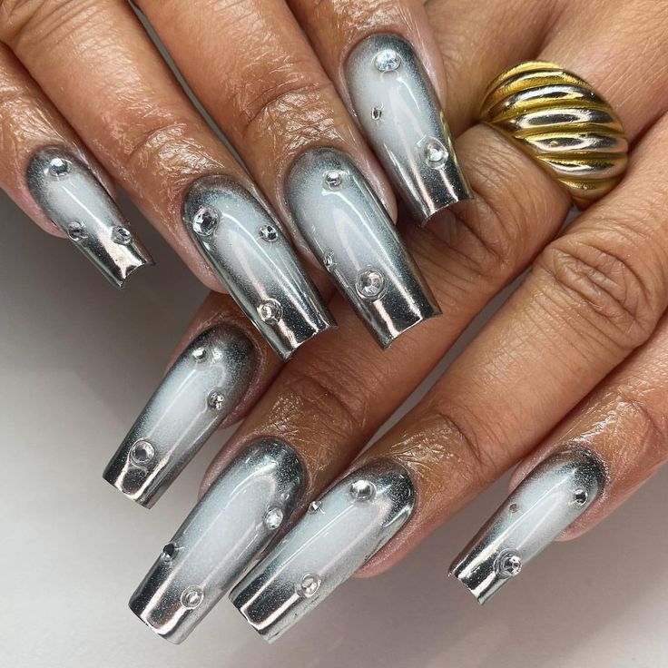 Elegant Silver Gradient Nail Design with Rhinestones and Gold Accents