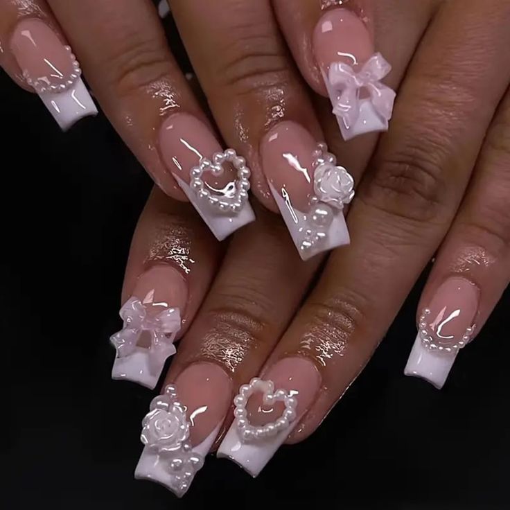 Charming Nude and White Nail Design with Intricate 3D Floral Motifs for a Romantic Touch.