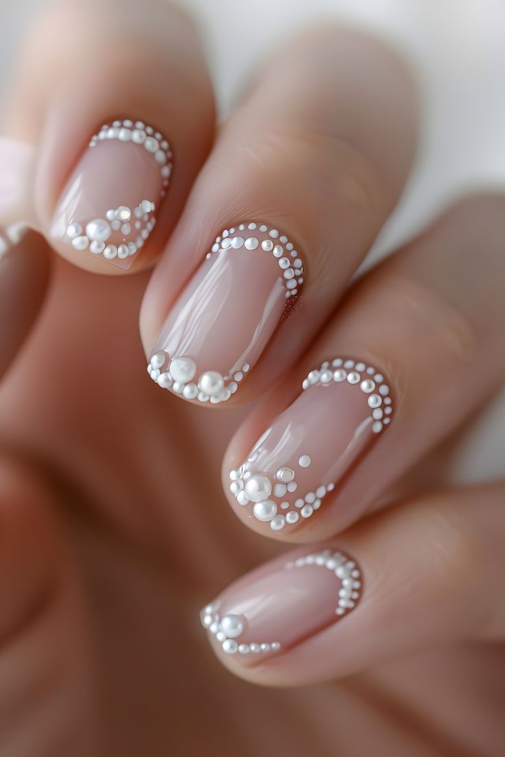 Sophisticated Nude Nails with Pearl Accents for Effortless Elegance.